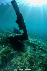 The skeletal bow of a tugboat wreck in Little Tub Harbour... by David Gilchrist 